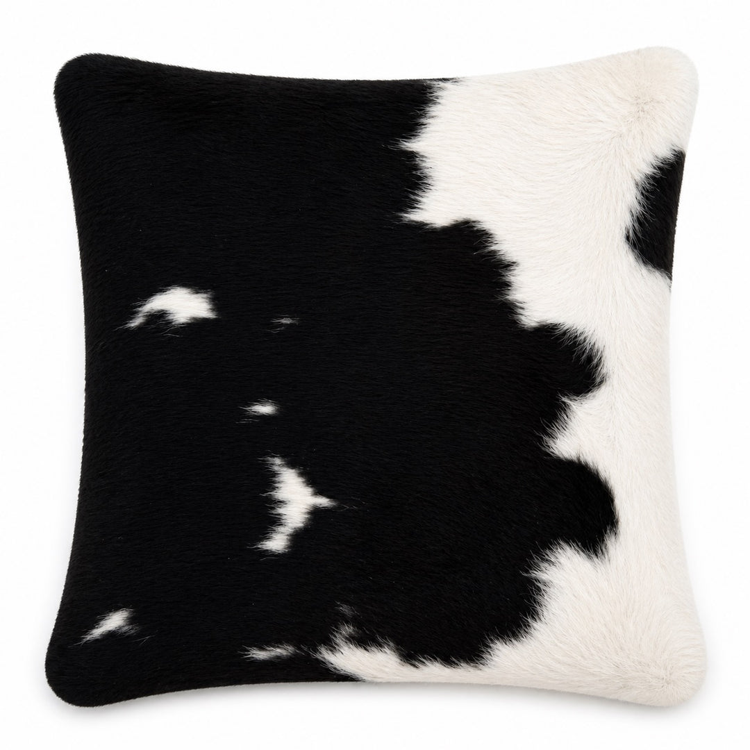 Cowhide cushion with suede reverse, 49cm x 49cm, by Cowhide Rugs London, showing a realistic cowhide pattern and textured surface.