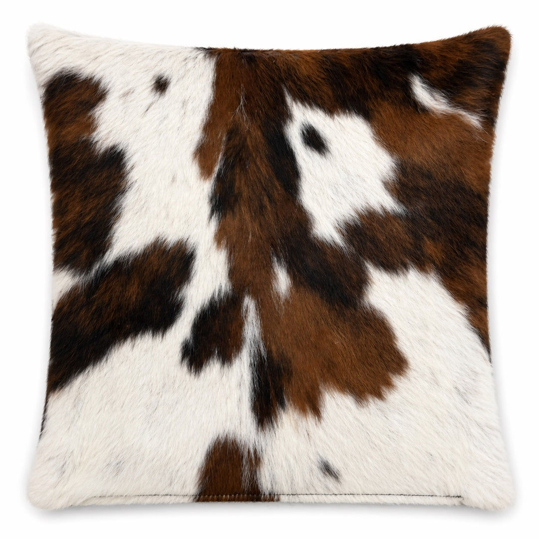 Cowhide cushion from Cowhide Rugs London, 15x15 inches, featuring natural cowhide with a textured, soft surface in a stylish design.