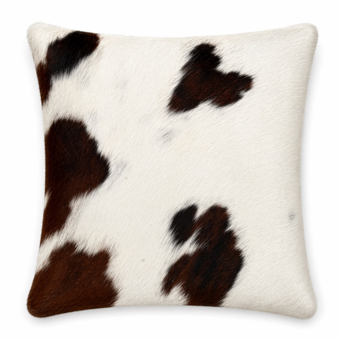 Cowhide Cushion by Cowhide Rugs London, 16x39cm, featuring natural cowhide with a two-sided design and a textured, rustic appearance.