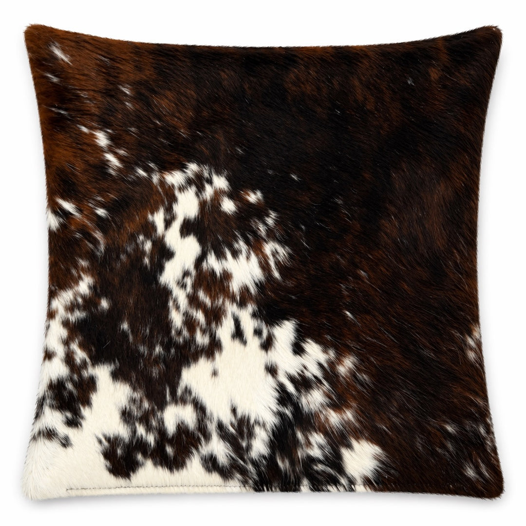Cowhide cushion from Cowhide Rugs London, 20x20 inches, natural cowhide with both sides visible, featuring a textured, animal print pattern.