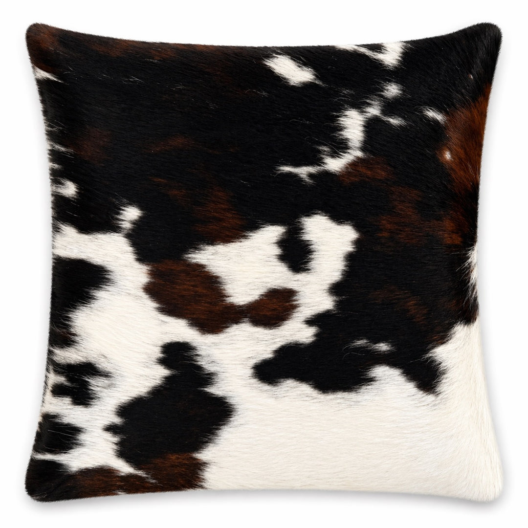 Cowhide cushion by Cowhide Rugs London, 21x39cm, featuring natural cowhide with a two-sided design and textured surface.