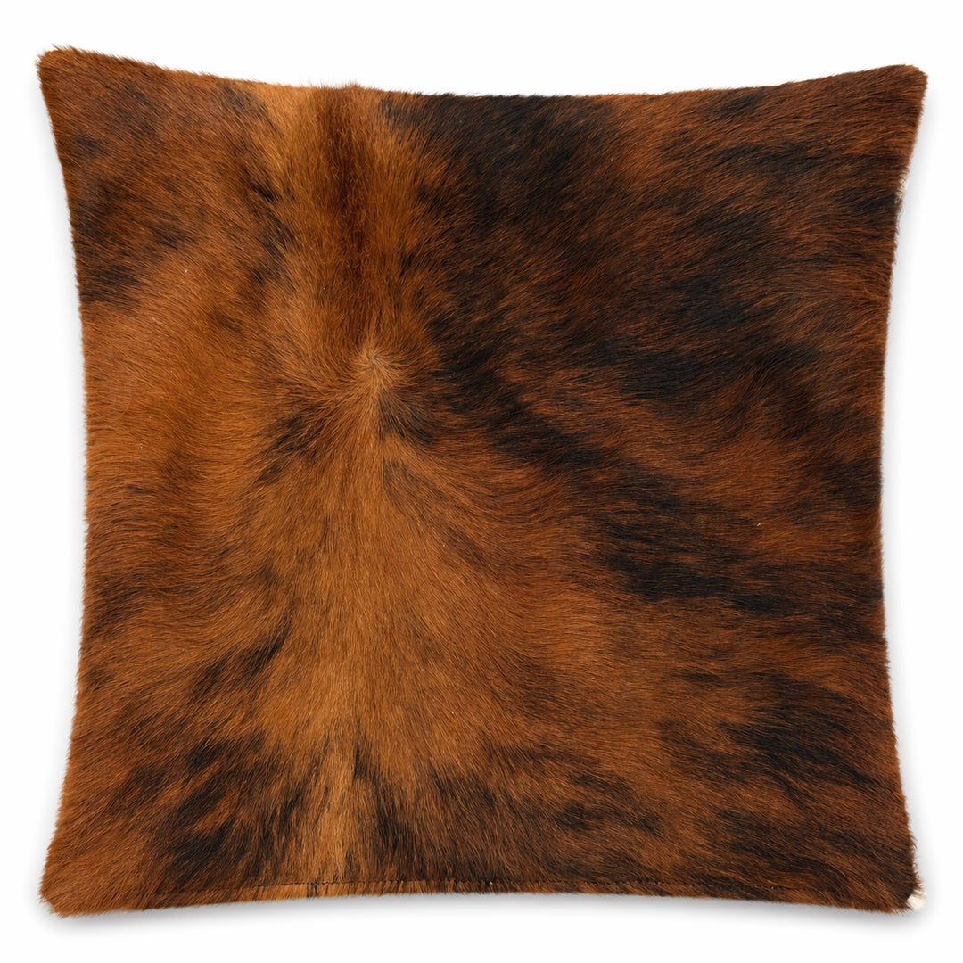 Cowhide cushion by Cowhide Rugs London, 22x39cm, featuring natural cowhide with a soft, textured surface and distinctive pattern.