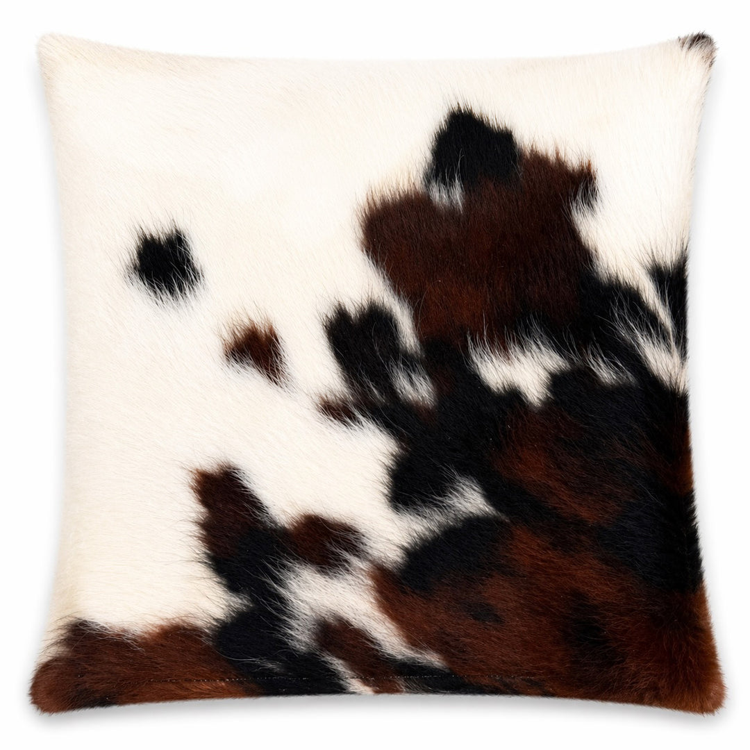 Cowhide cushion from Cowhide Rugs London, 24x39cm, with natural cowhide pattern on both sides, beige and brown tones.