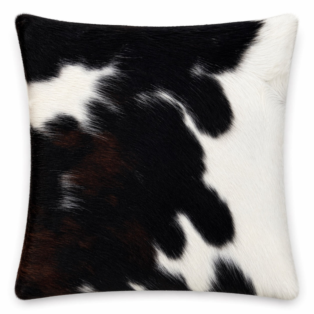 Cowhide cushion from Cowhide Rugs London, 36cm x 39cm, natural cowhide with distinctive black and white pattern, both sides visible.