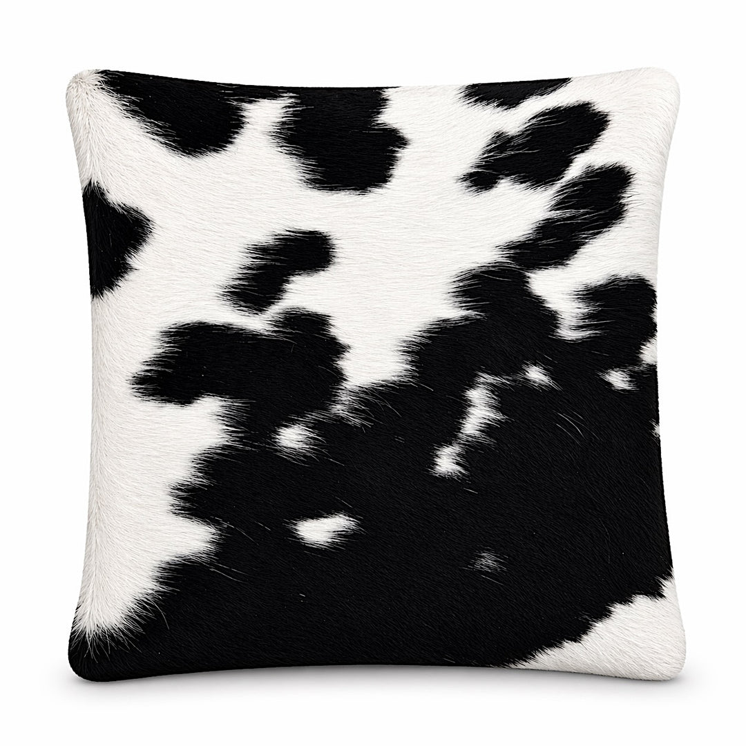 Cowhide cushion with reversed Suedette side, 49cm x 49cm, by Cowhide Rugs London, showing the textured upholstery and natural cowhide pattern.