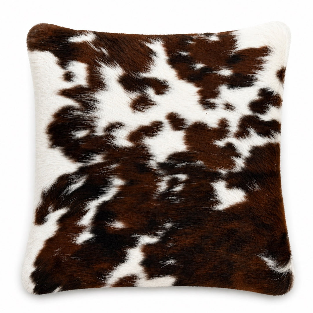 Cowhide cushion with suede reverse, 49cm x 49cm, by Cowhide Rugs London, showcasing natural cowhide pattern and soft suede backing.