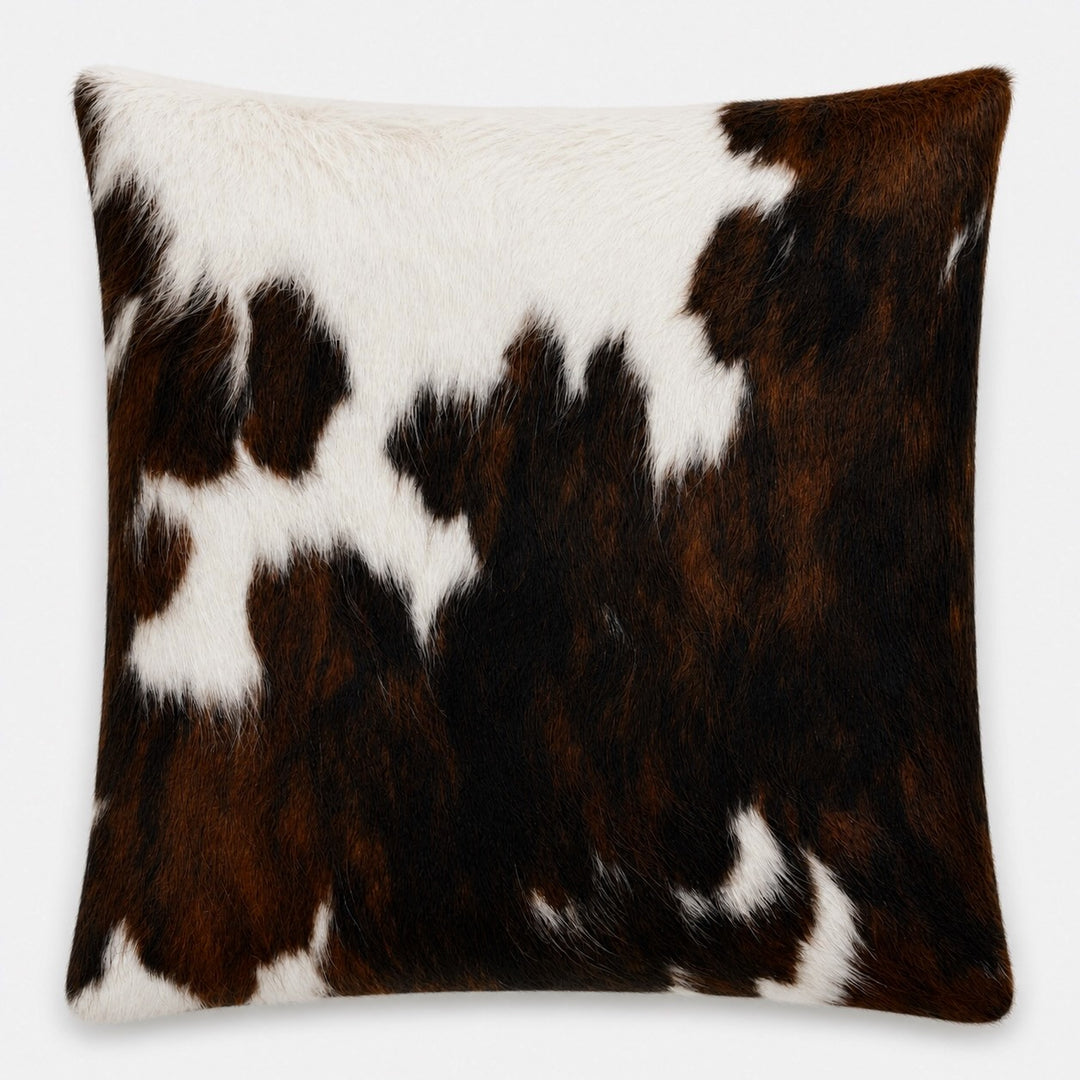 Cowhide cushion with suede reverse, 49cm x 49cm, from Cowhide Rugs London, showcasing natural cowhide pattern and soft suede backing.