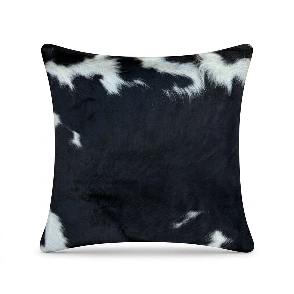 Cowhide cushion with suedette reverse, 49cm x 49cm, by Cowhide Rugs London, featuring natural cowhide pattern and soft fabric reverse.