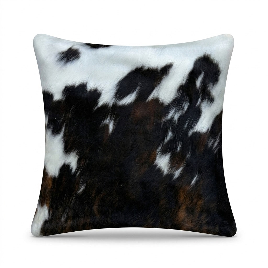 Cowhide cushion with suede reverse, 49cm x 49cm, by Cowhide Rugs London, showing the textured cowhide front and soft suede back.