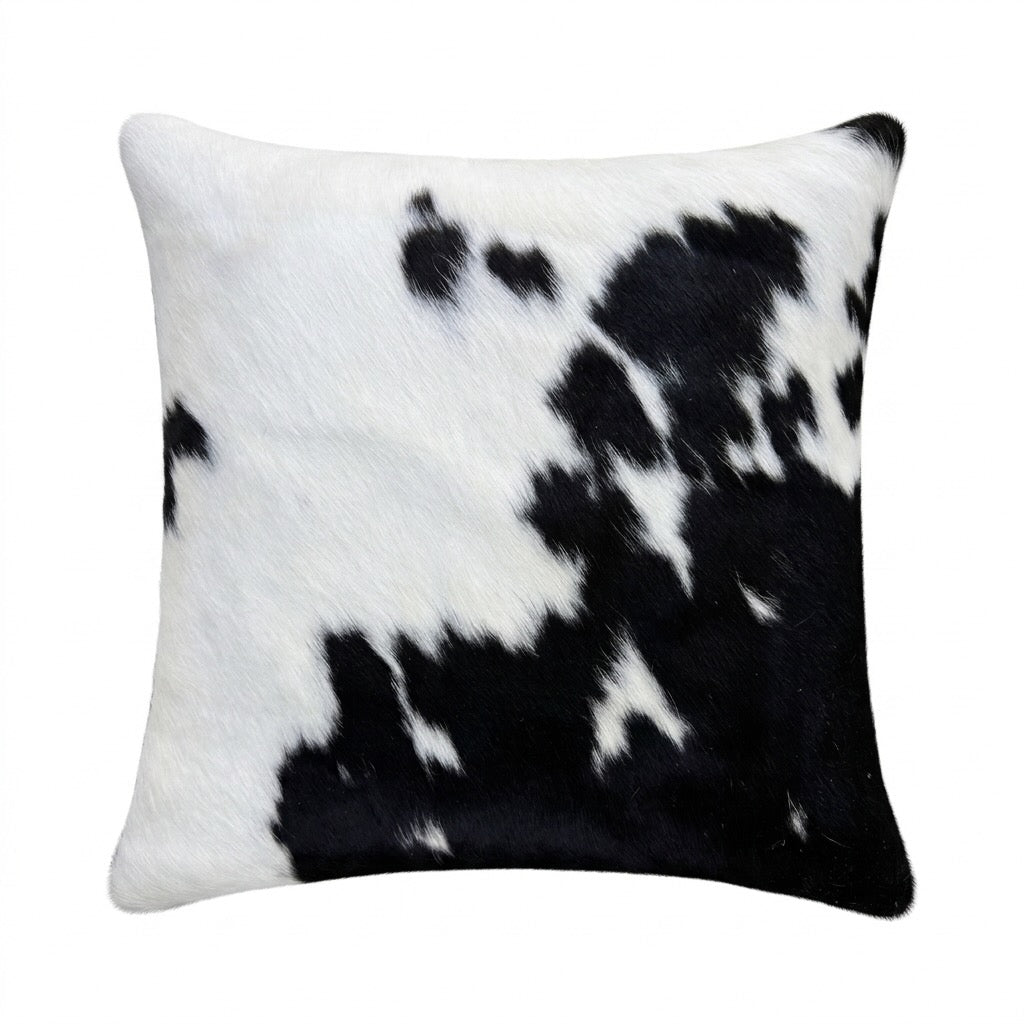 Cowhide cushion with suede reverse, 49cm by 49cm, from Cowhide Rugs London, featuring natural cowhide pattern and soft suede backing.