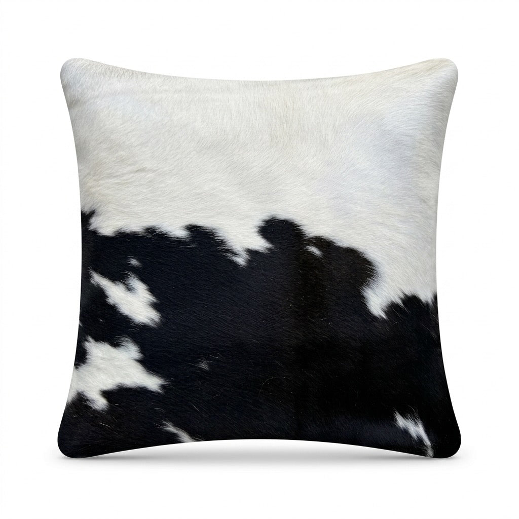 Cowhide cushion with suede reverse, 49cm x 49cm, by Cowhide Rugs London, showcasing natural cowhide pattern and soft suede backing.