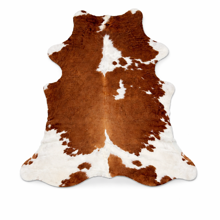 Natural cowhide rug from Cowhide-Rugs-London, 200cm x 180cm, showcasing the unique pattern and soft texture of the premium cowhide material.