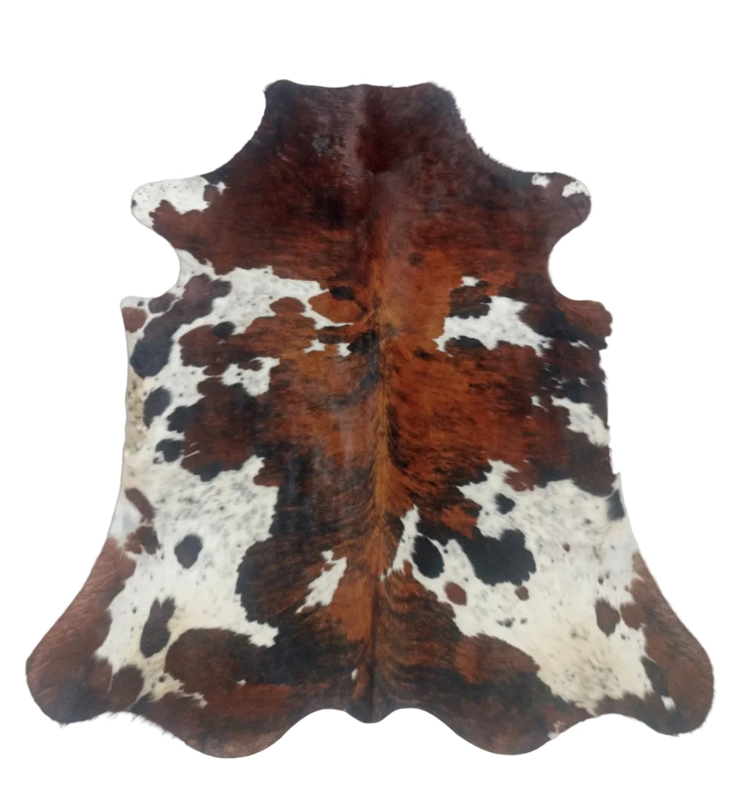 Large premium tricolour cowhide rug from Cowhide-Rugs-London, with a natural cowhide pattern in black, white, and brown tones.
