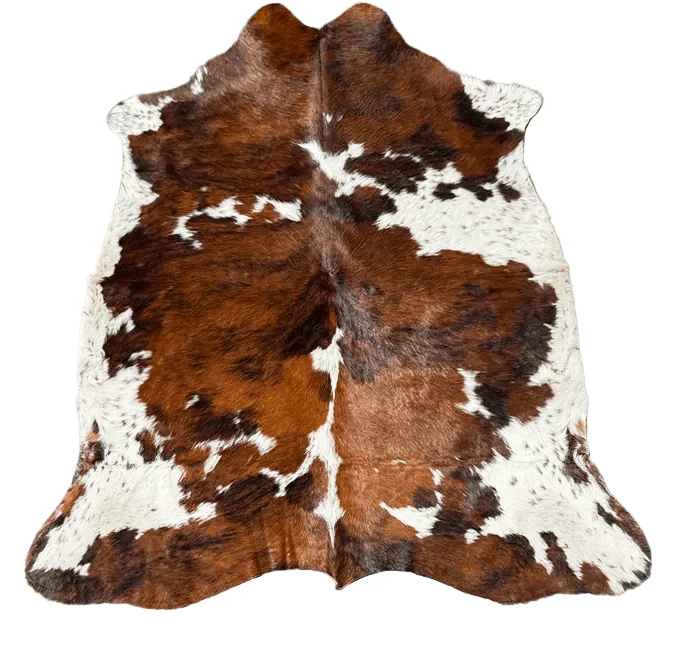 Brown and white cowhide rug with natural hair-on-hide texture,