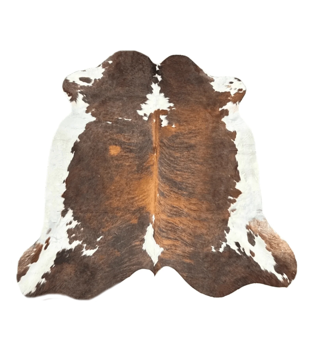 A natural cowhide rug with a classic brown and white spotted pattern, 
