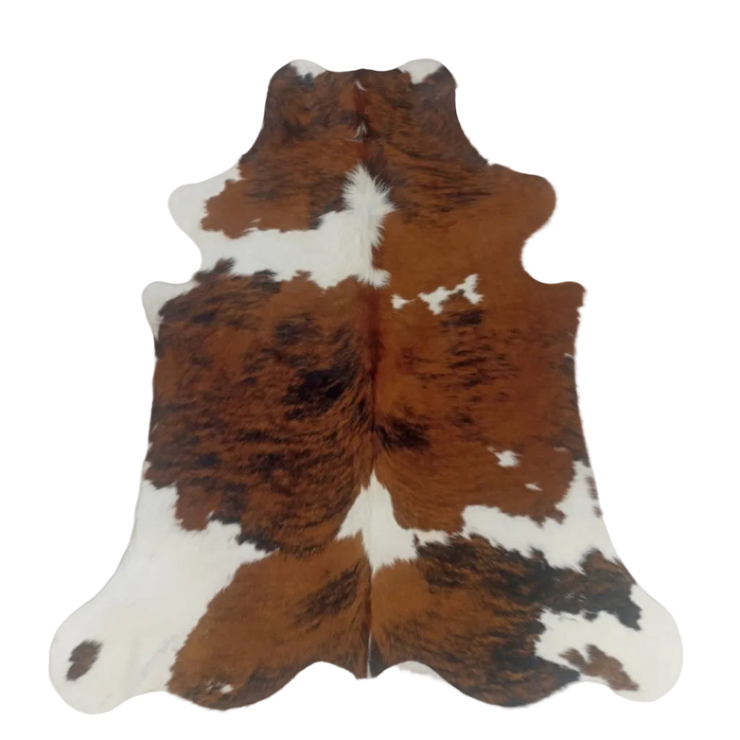 Brown and white cowhide rug 