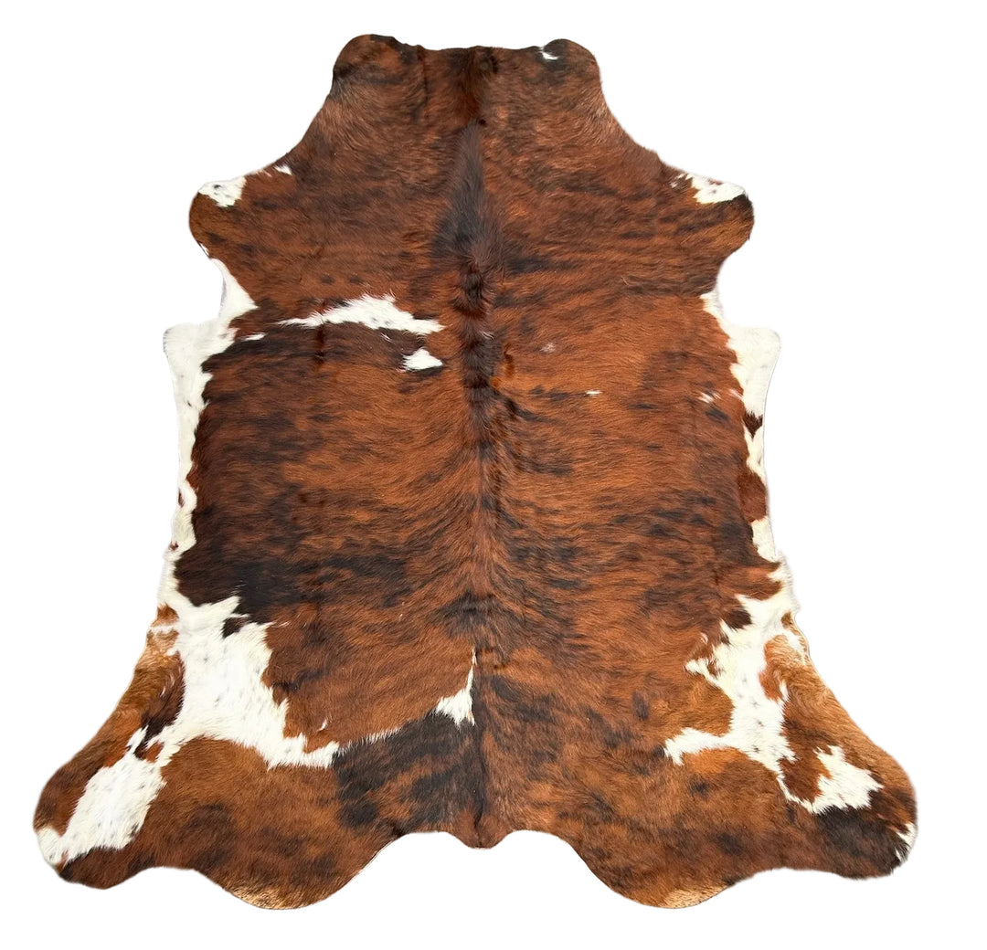 Brown and white cowhide rug 