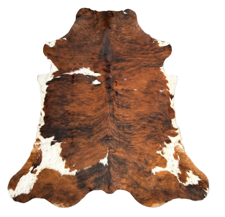 Brown and white cowhide rug 