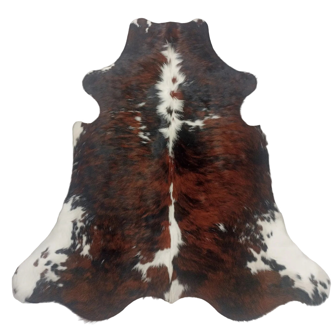 A natural cowhide rug with a brown and white spotted pattern