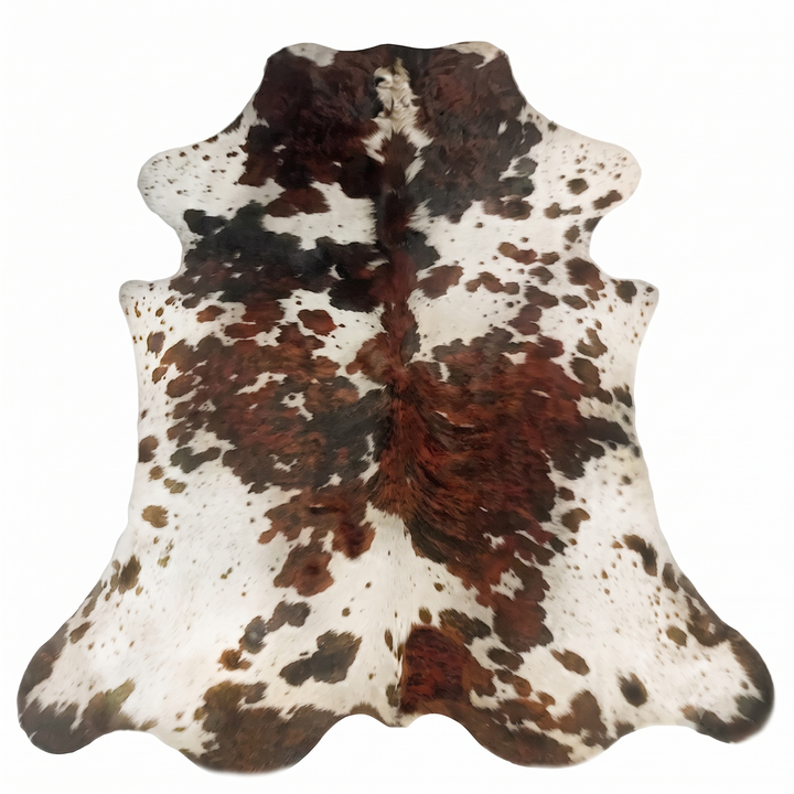 A natural cowhide rug with a brown and black spotted pattern on a white base, shown flat against a solid white background.