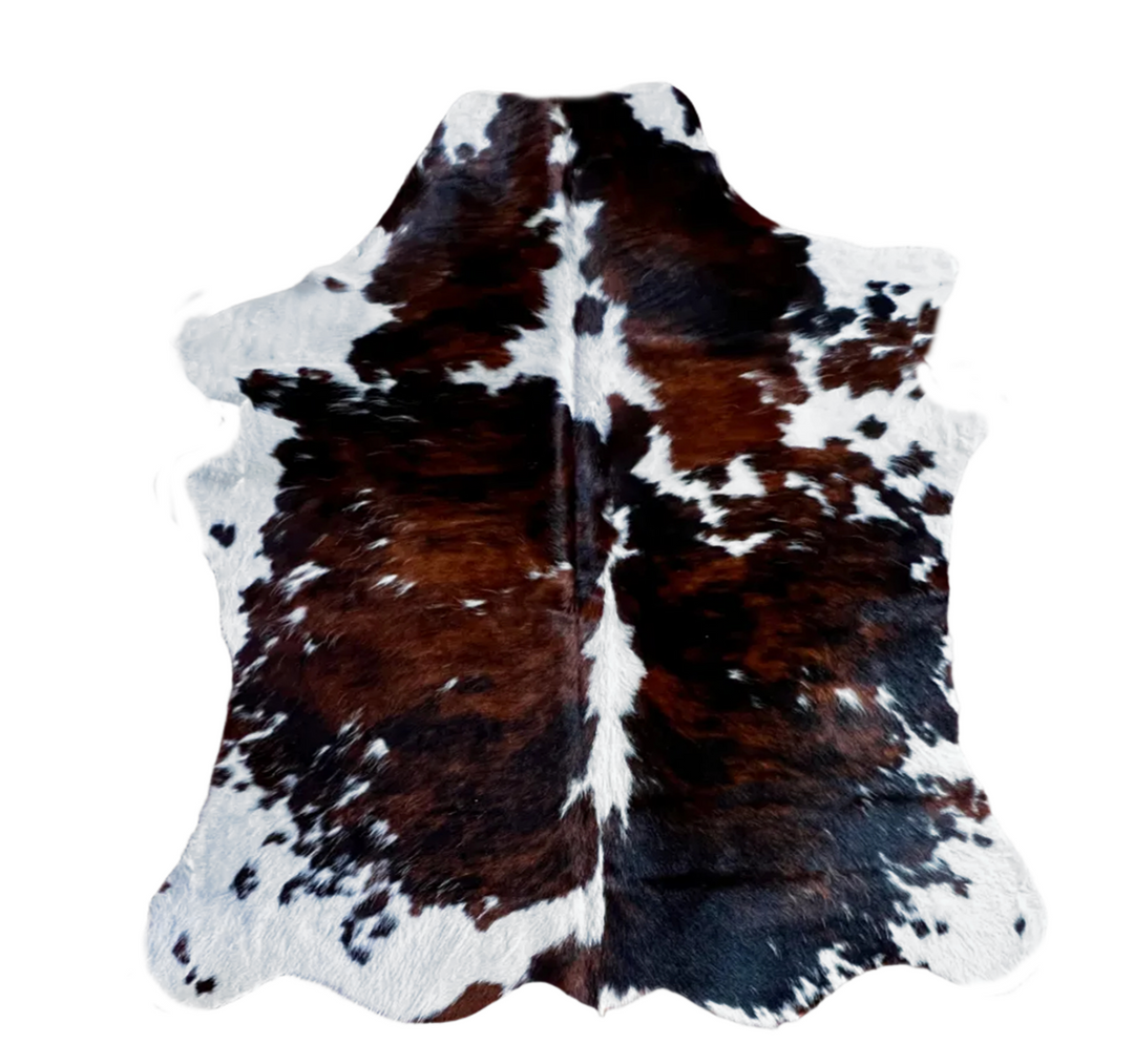 Cowhide Rug AU188 from Cowhide Rugs London, 180cm x 146cm, natural cowhide with distinctive black and white patches.