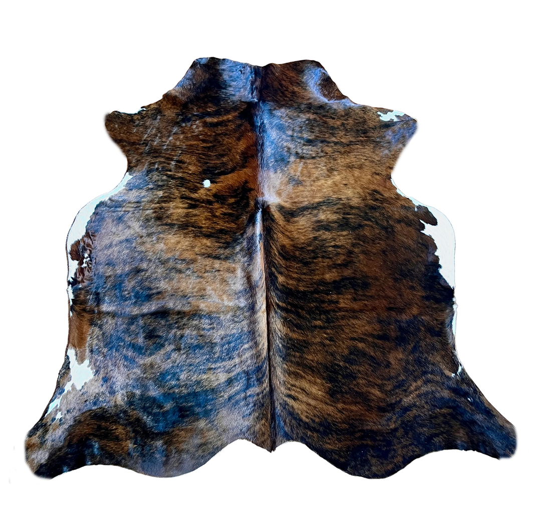Natural cowhide rug from Cowhide Rugs London, 200cm x 170cm, with distinctive black and white patches on soft leather.