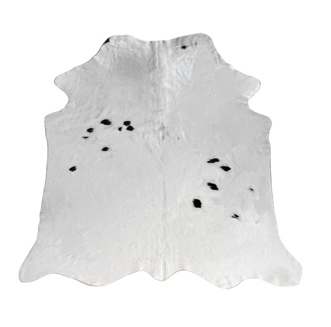 A white cowhide rug with black spots, 