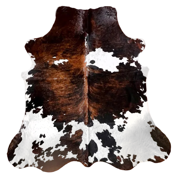 Natural cowhide rug from Cowhide Rugs London, 215cm x 194cm, with distinctive black and white patches and a soft, textured surface.