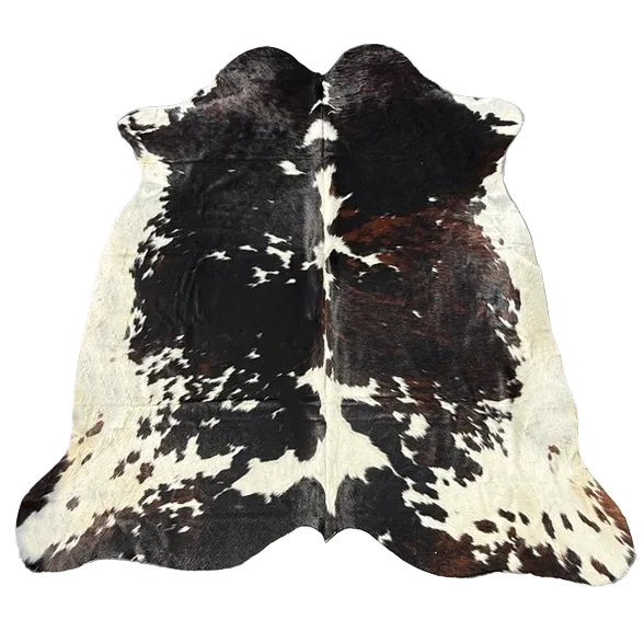 A natural black and white cowhide rug 