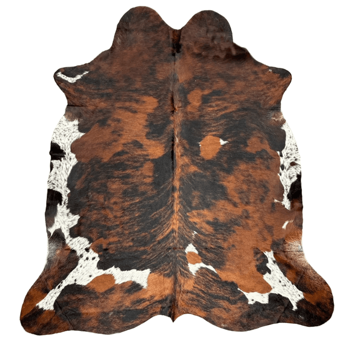 Large premium cowhide rug by Cowhide Rugs London, 240cm x 200cm, natural brown and white cowhide pattern.