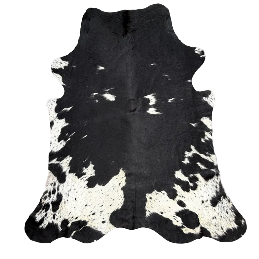 Black and white premium cowhide rug by Cowhide Rugs London, 185cm x 172cm, with natural cowhide texture and pattern.