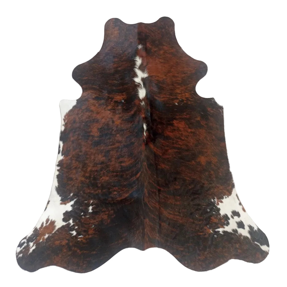 Natural cowhide rug from Cowhide Rugs London, measuring 1.92m x 1.64m with a unique pattern and soft, durable surface.