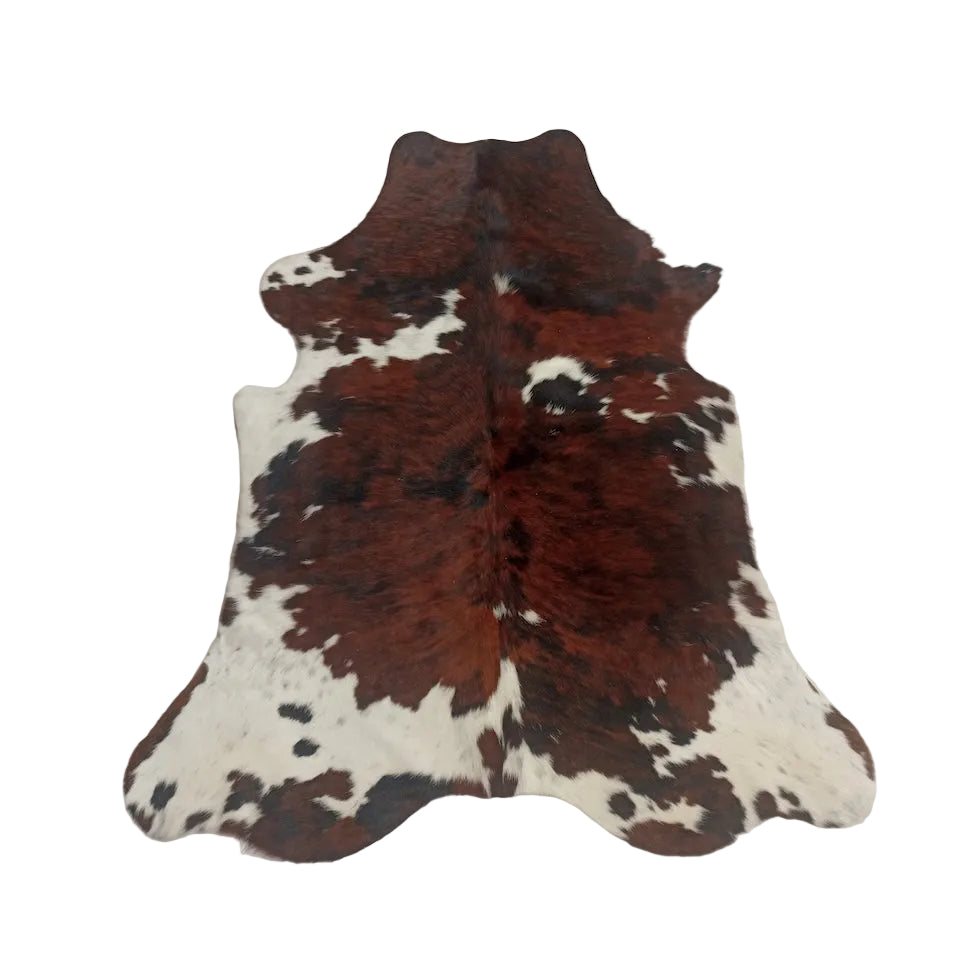 Natural cowhide rug from Cowhide Rugs London, 1.81m x 1.57m, showcasing its unique pattern and soft leather texture.
