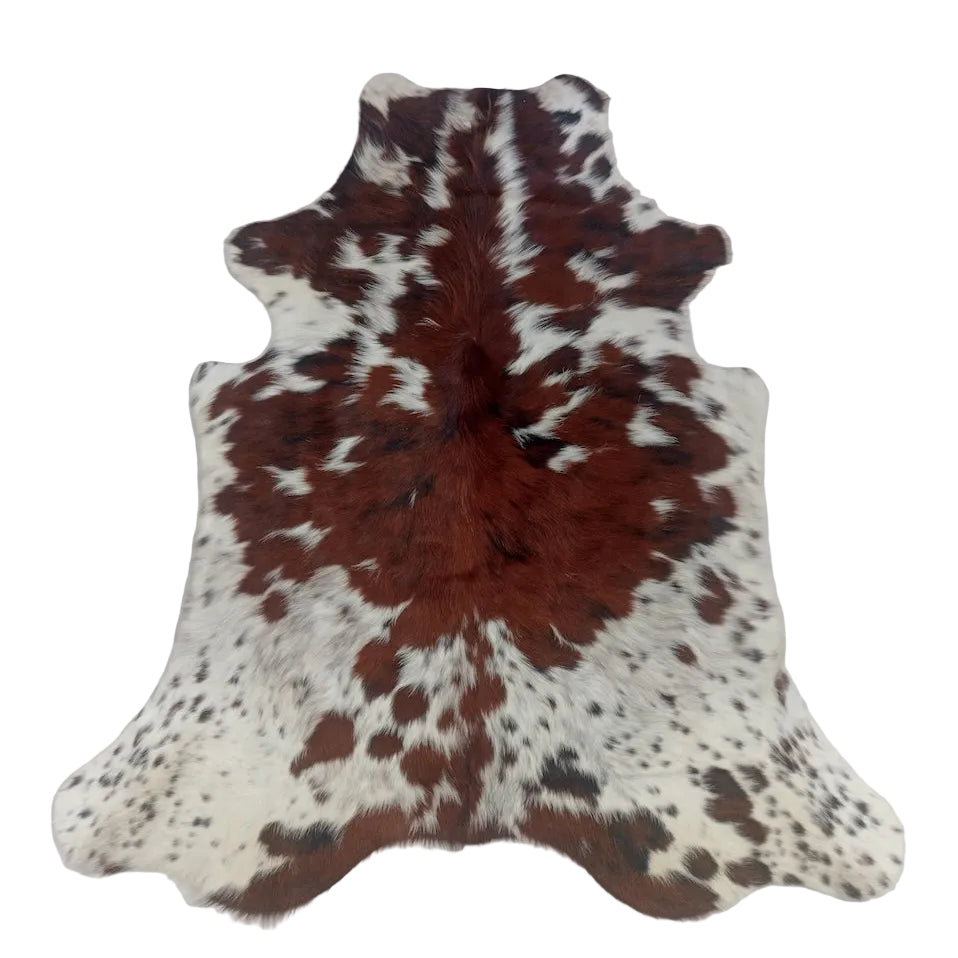 Natural cowhide rug from Cowhide Rugs London, size 1.79m x 1.61m, with distinctive black and white patches.