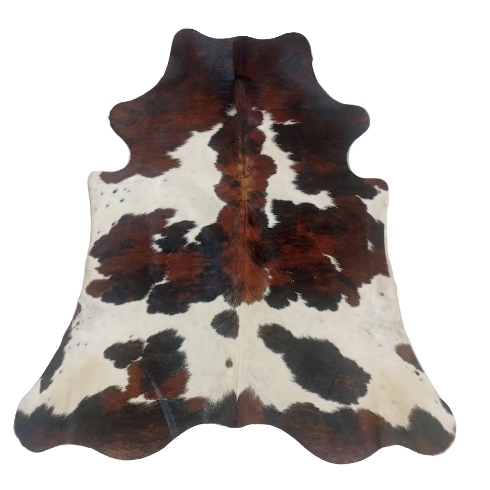 Natural cowhide rug from Cowhide Rugs London, measuring 1.85m x 1.63m with a distinctive spotted pattern and soft texture.