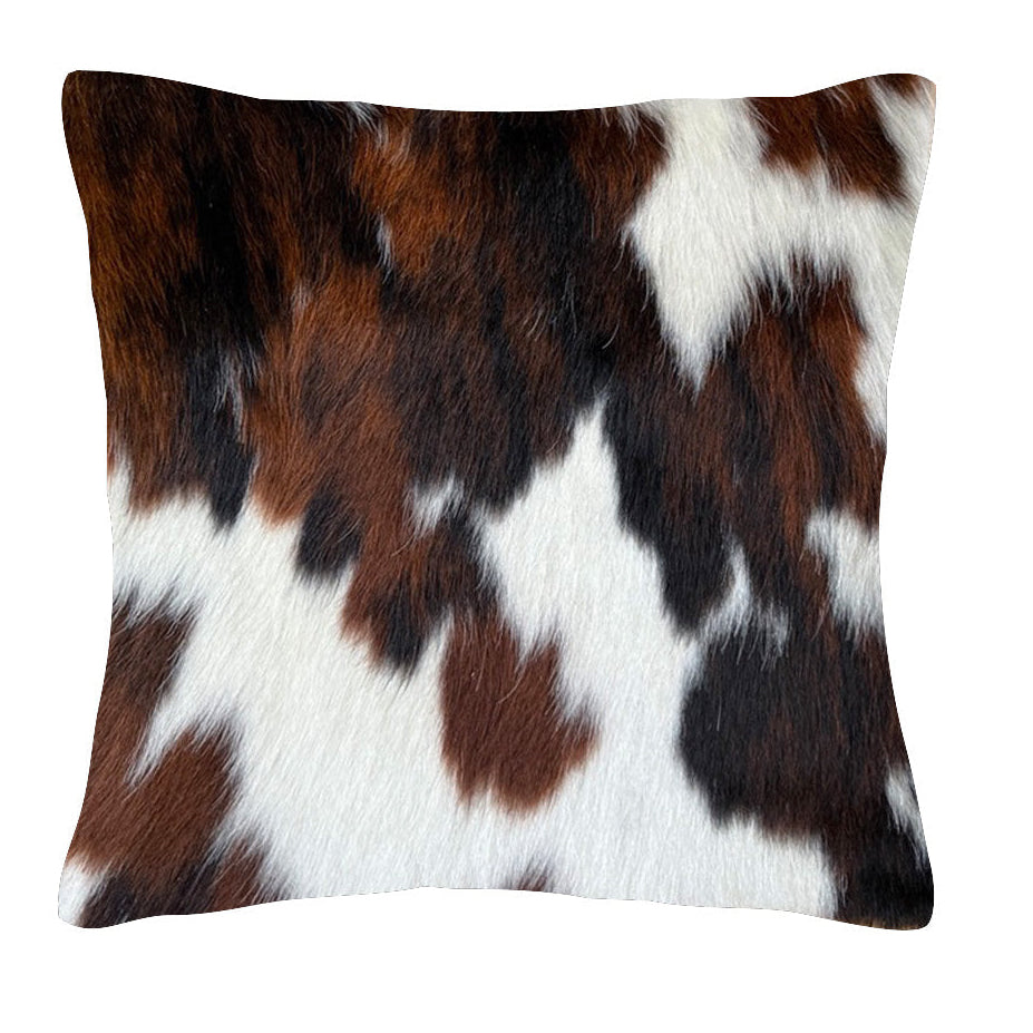 Cowhide cushion with suedette reverse, 39cm x 39cm, featuring a natural cowhide pattern and soft textured backing.
